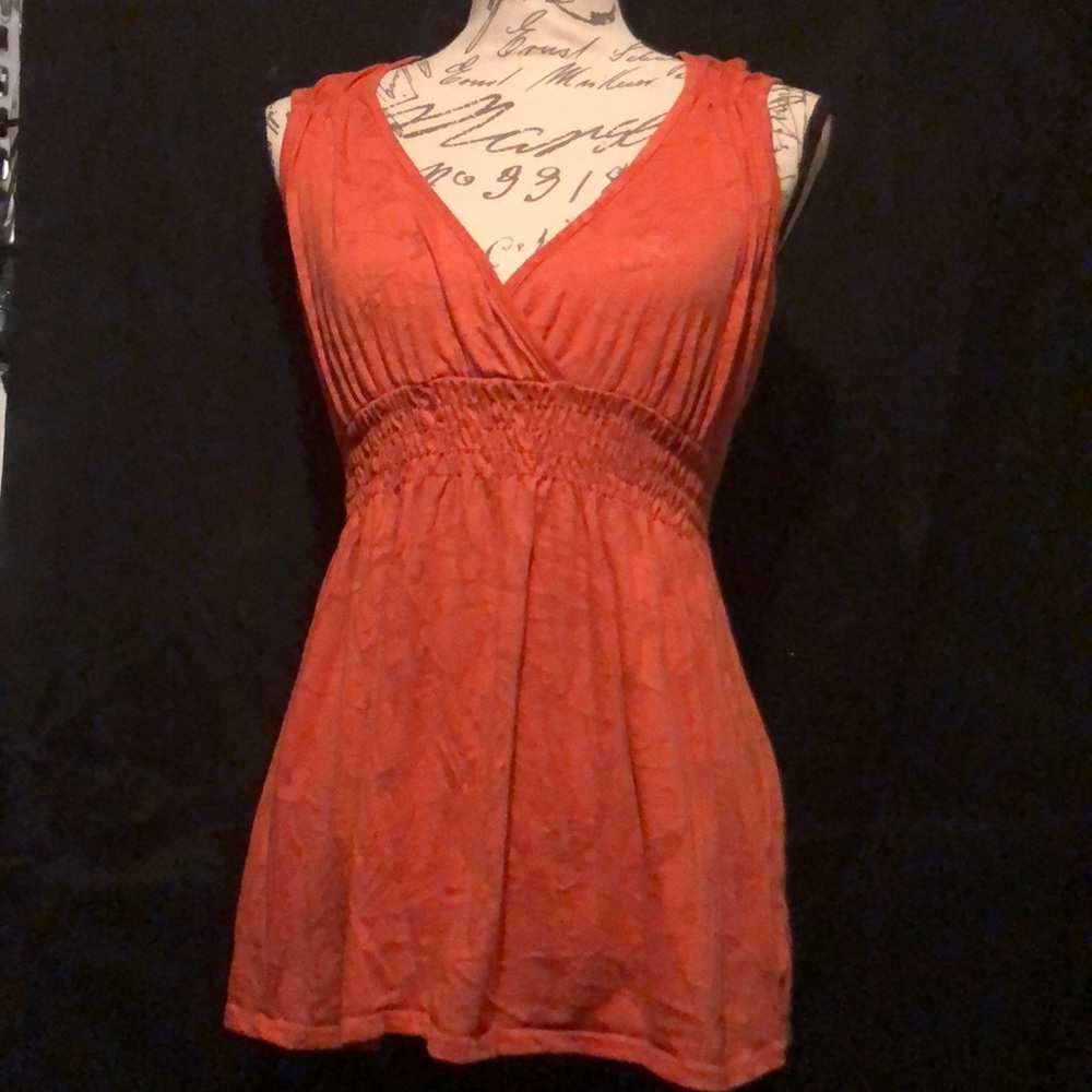 Orange sleeveless shirt